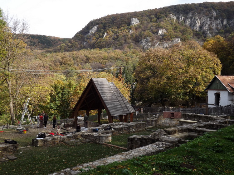 The ruins of the monastery at the foot of the rocky mountainside