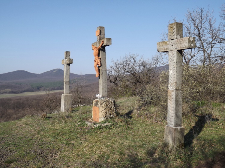 The crosses of the Calvary stand above Kóspallag