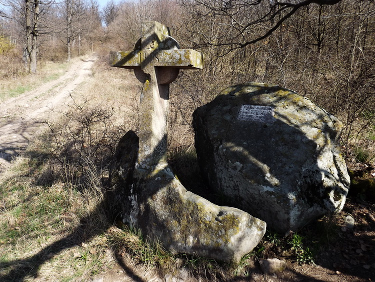 The Barna Ferenc Stone Cross stands beside the hard climbing dirt road