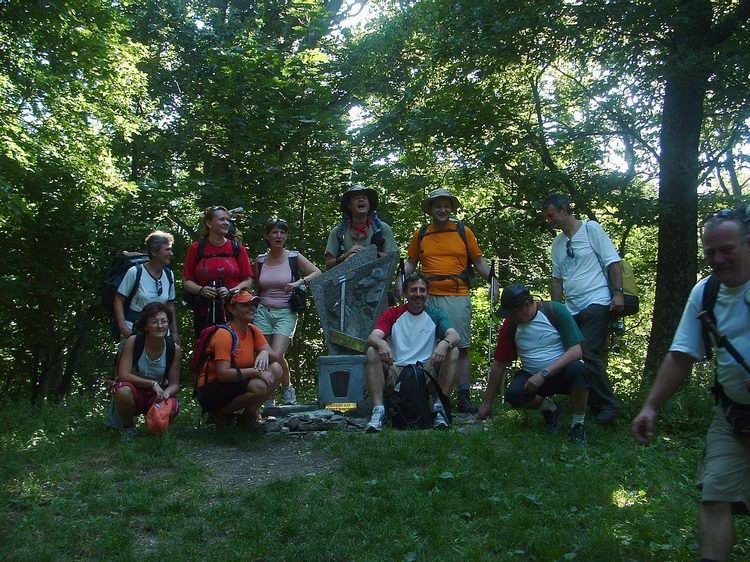 Hiker team at the small monument of the Blue Trail