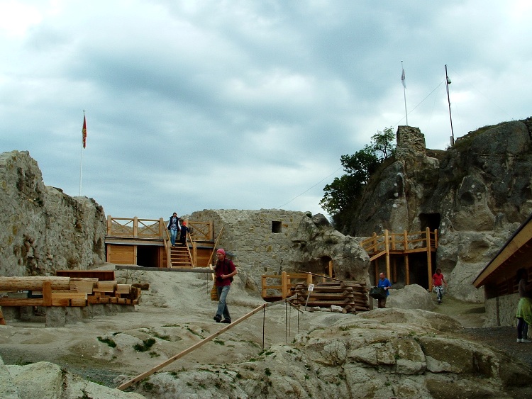 Visitors ramble among the old ruins of Castle of Sirok