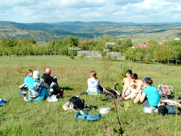 Resting hiker team on the meadow above Mályinka village