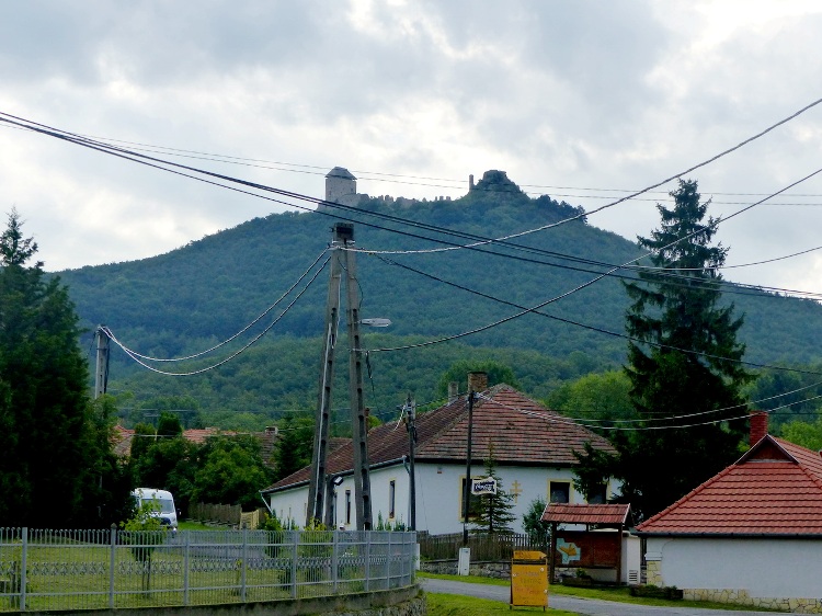 The Castle Hill towers behind the houses of Mogyoróska