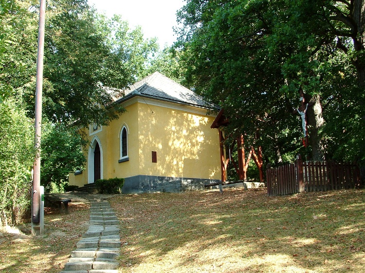 A wooden belfry stands beside the crypt of Meczner Family