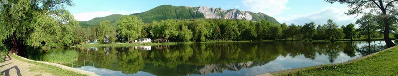 Panoramic view from the shore of Lak-völgyi-tó Lake towards the Bél-kő Mountain